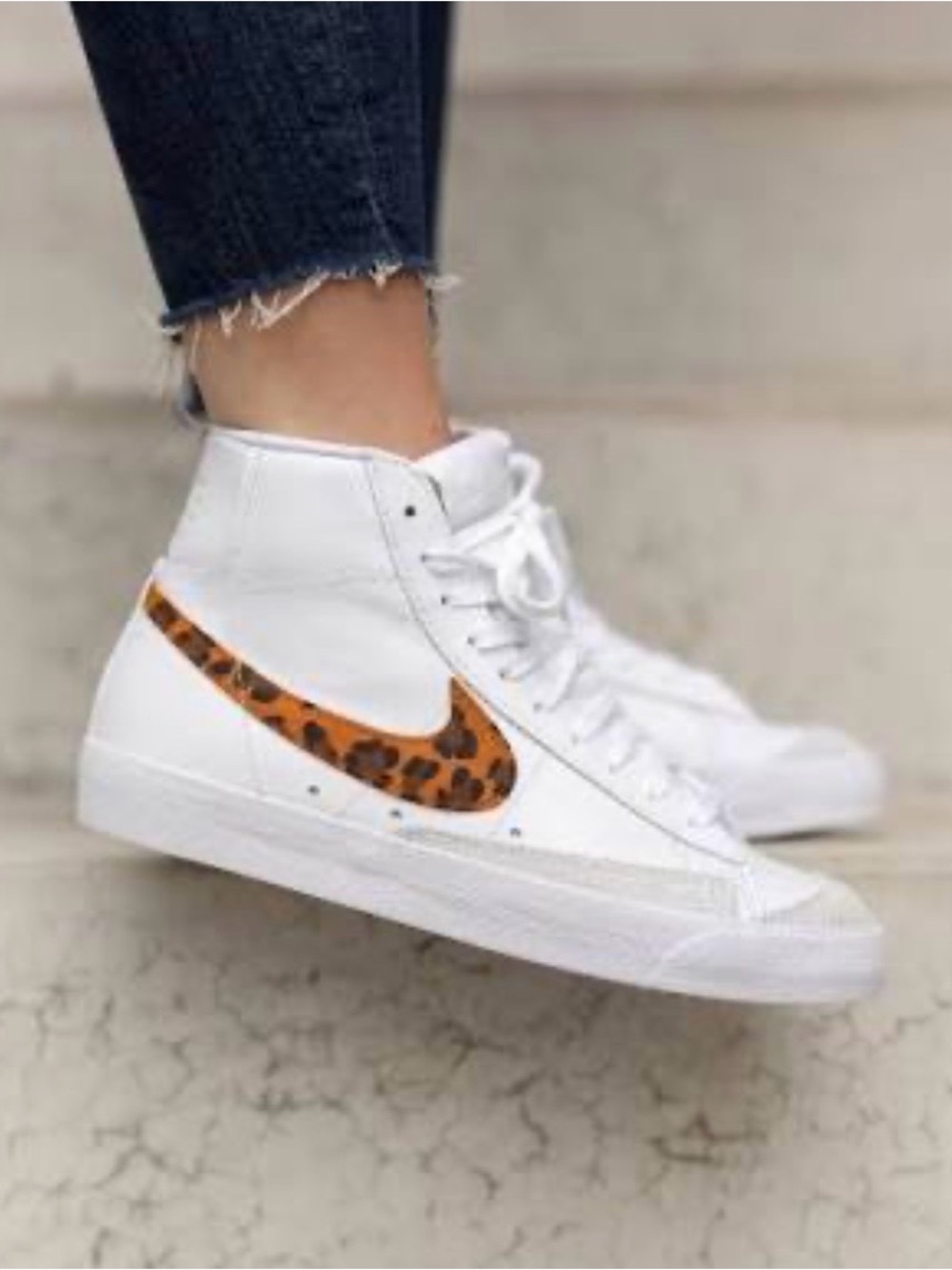 Nike White High-Top Sneakers with Leopard Swoosh